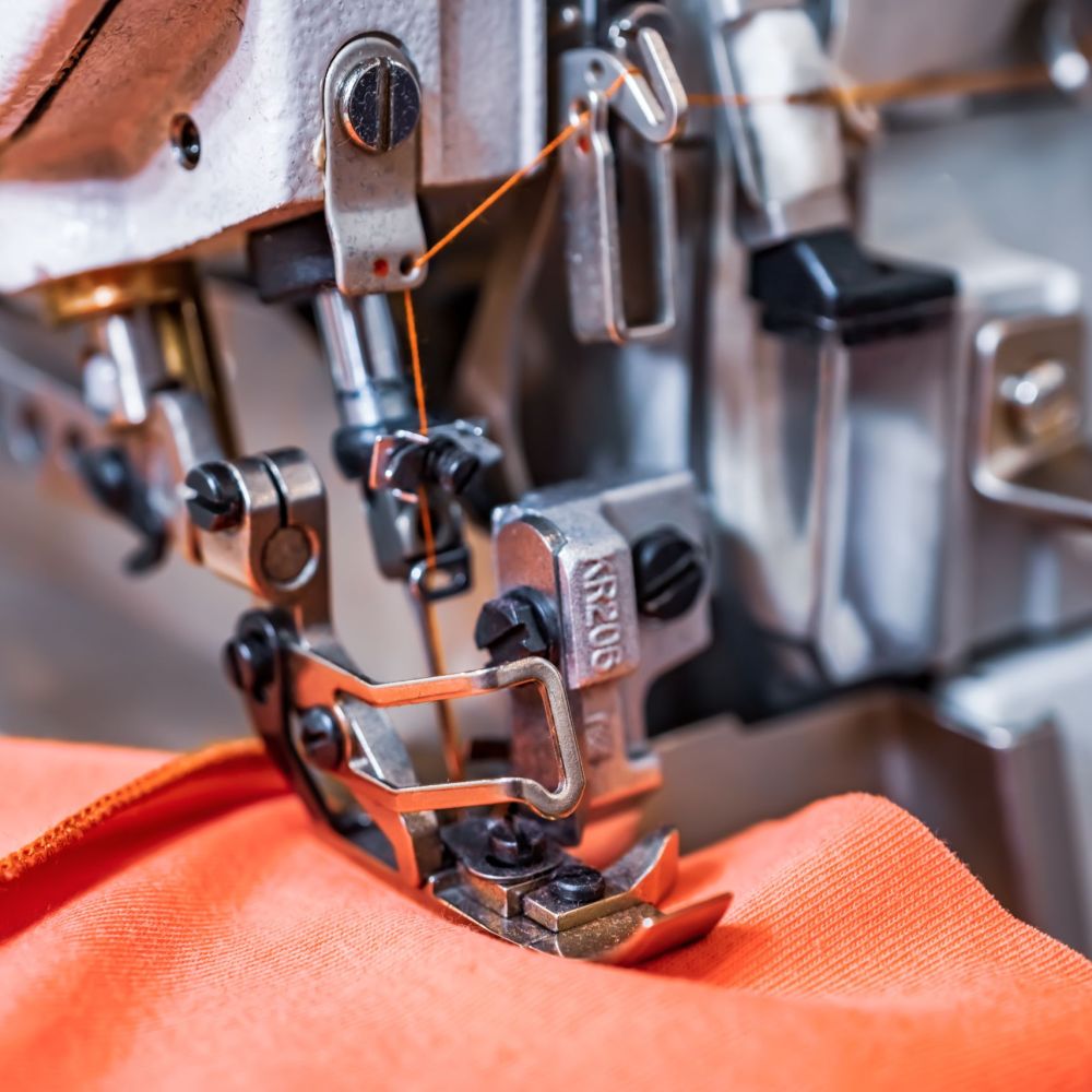 Professional sewing machine close-up. Modern textile industry.